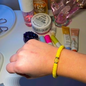 Yellow bracelet with smiley face in the middle!💗